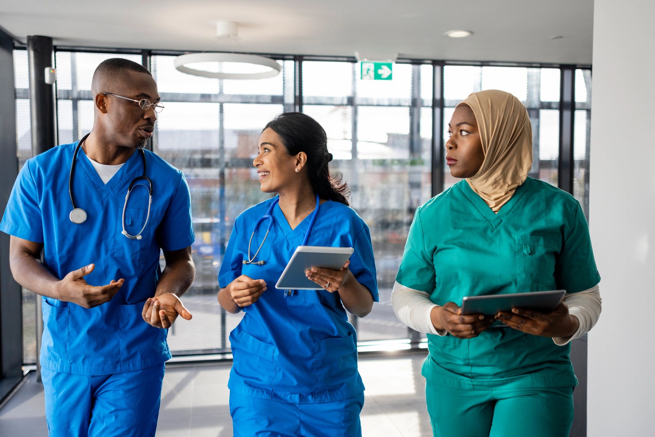 Medical professionals walking together in a corridor