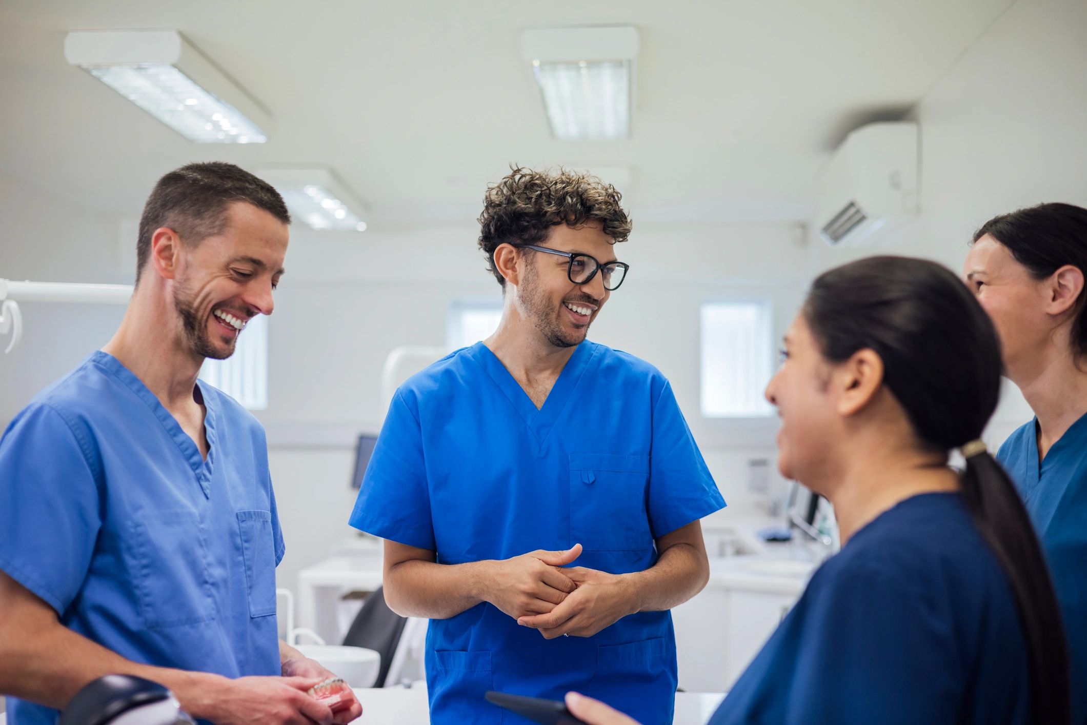 Healthcare professionals discussing work in a practice setting