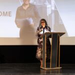 Passionate Entrepreneur Presenting to a Live Audience
