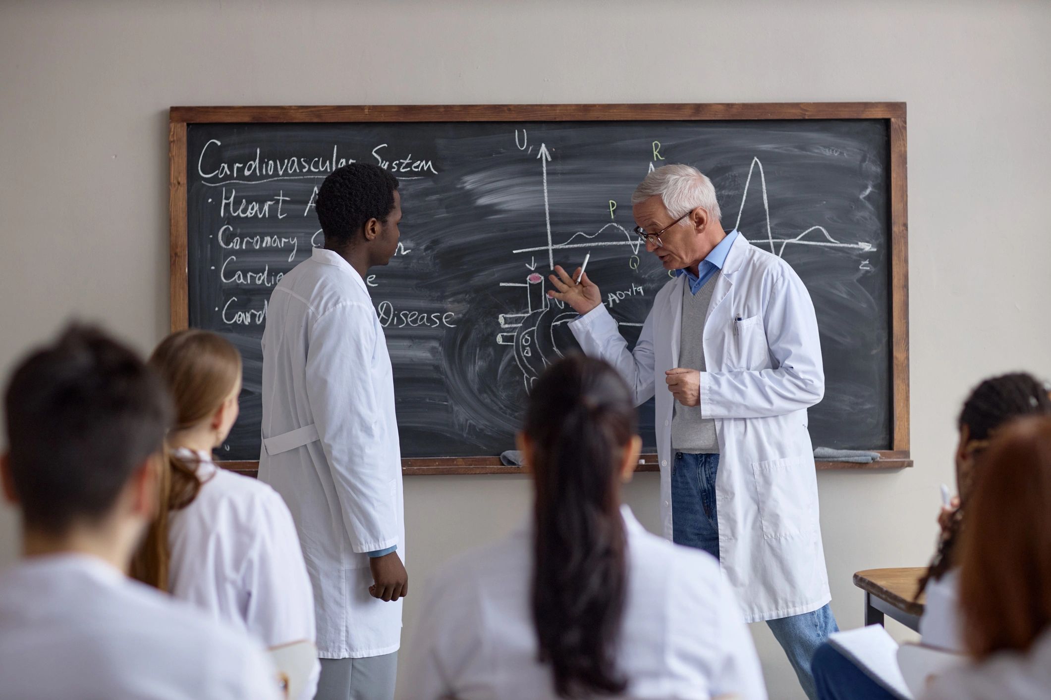 Medical instructor teaching healthcare professionals in a classroom