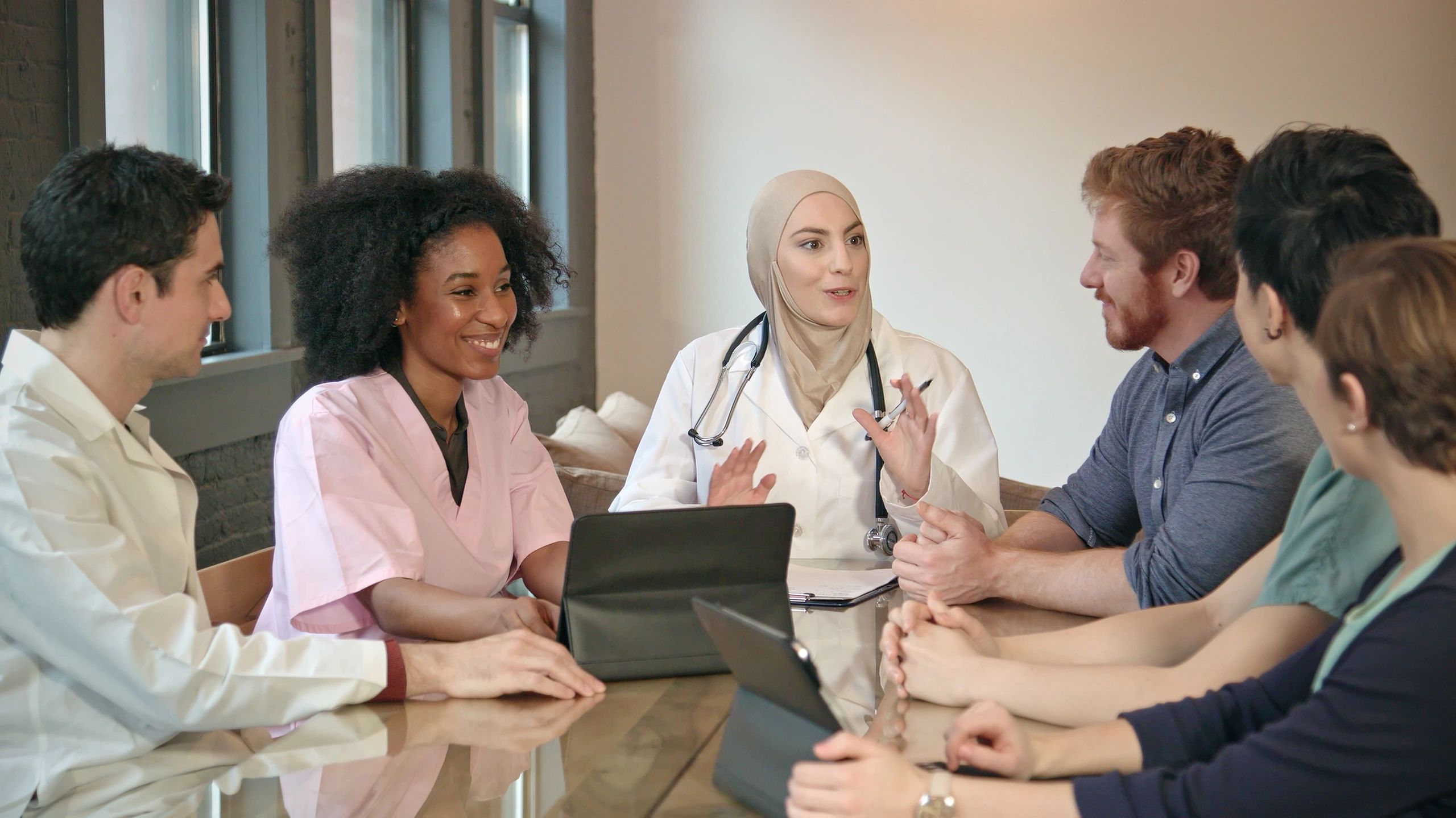 Healthcare consulting team meeting in a professional setting
